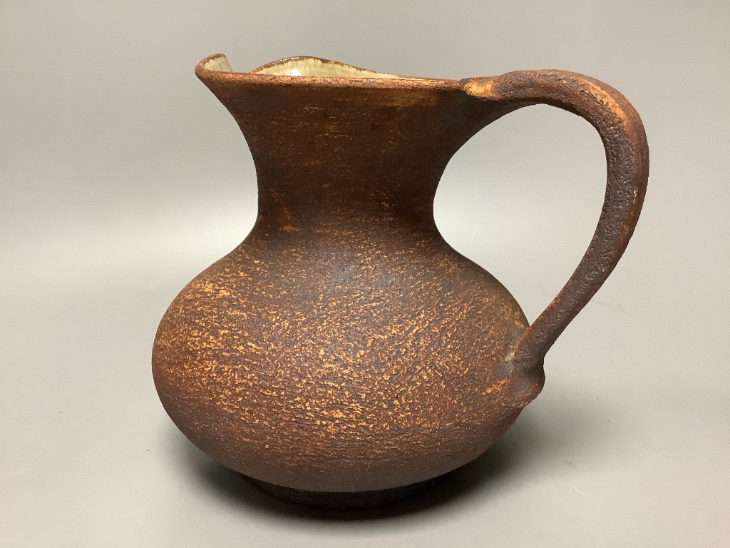 Waistel Cooper (1921-2003). A pottery jug with textured glazed body, height 18cm